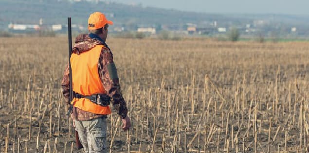 Hunters Wearing Orange Camo